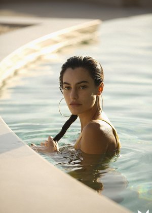 Smiley cutie with pigtail and pierced belly button rubbing her clit